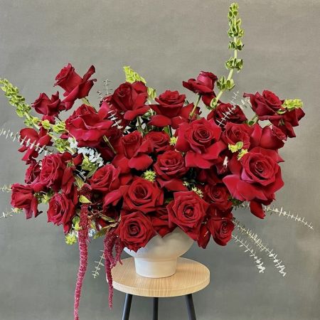 Conroy's Flowers San Diego San Diego - Dramatic and unforgettable, this breathtaking arrangement features an abundant display of deep red roses bursting with passion and intensity. Accented with sculptural greenery and cascading textures, it creates a bold, modern silhouette that commands attention. Perfect for grand celebrations, luxury events, or when you want to make an extraordinary romantic statement that leaves a lasting impression.

**Flowers and vase my vary based on availability. We will preserve the color palette and theme of the design.
