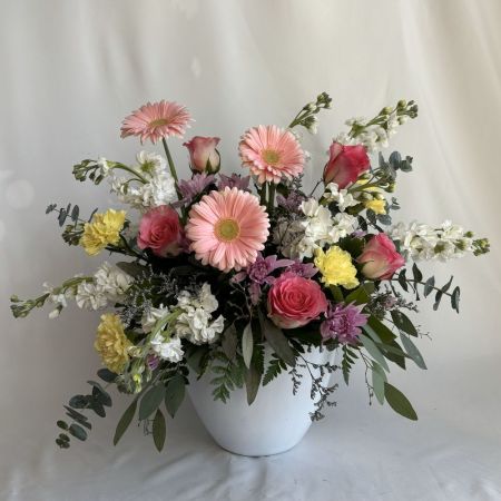 Conroy's Flowers San Diego San Diego - A charming garden-inspired arrangement bursting with soft pink gerberas, blush roses, creamy whites, and sunny yellow accents. Artfully gathered with lush eucalyptus and delicate filler blooms, this design feels fresh, joyful, and effortlessly elegant. Perfect for birthdays, thank-you moments, or brightening any space with a touch of natural beauty and graceful color harmony.

**Flowers and vase my vary based on availability. We will preserve the color palette and theme of the design.
