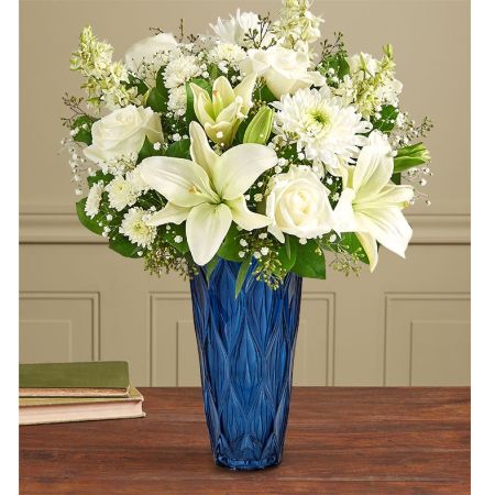 Conroy's Flowers El Cajon El Cajon - Find comfort during life's difficult moments with "Peaceful Harmony™ All White." White flowers exude peaceful elegance, and this classic arrangement is hand-gathered by our caring florists. It is crafted in our graceful Blue Harmony vase, conveying heartfelt condolences. With our same-day flower delivery, you can promptly share this comforting arrangement with those who are mourning. "Peaceful Harmony™ All White" is a thoughtful and elegant expression that brings solace and warmth during challenging times, offering support and comfort.