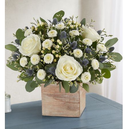 Conroy's Flowers El Cajon El Cajon - Bring cherished memories flooding back with the "Cherished Garden™ Bouquet." This exclusive country-inspired bouquet is gathered with soothing, pearl-white blooms in a loose, natural style. Complementing the arrangement is a grey-washed wooden cube, featuring soft tones and natural textures that add to the warmth and comfort of your sentiment. With our same-day flower delivery, you can promptly share this thoughtful and comforting bouquet with those who are mourning. "Cherished Garden™ Bouquet" is a heartfelt and elegant expression that brings solace and warmth during challenging moments, offering comfort and support.





