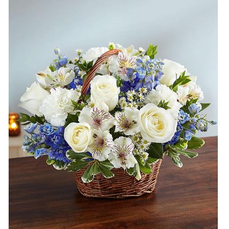 Conroy's Flowers El Cajon El Cajon - Offer peace and comforting prayers with "Peace, Prayers & Blessings™ Blue & White." During times of loss, this arrangement of elegant blue delphinium and white roses is artistically designed inside a keepsake willow basket. It serves as a touching way to convey your sincerest blessings. With our same-day flower delivery, you can promptly share this thoughtful arrangement with those who are facing difficult times. "Peace, Prayers & Blessings™ Blue & White" is a heartfelt expression that brings solace and warmth, offering support during challenging moments.