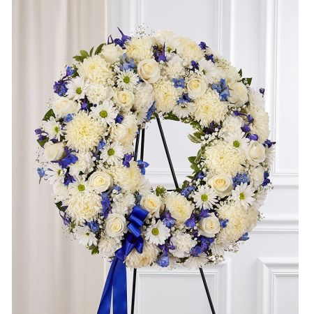 Conroy's Flowers El Cajon El Cajon - The Serene Blessings™ Standing Wreath in Blue and White is a heartfelt expression of sympathy, designed to bring comfort during challenging times. Crafted with meticulous care, this timeless standing wreath features a harmonious blend of soothing blue and white blooms, creating a lush and full presentation. Each petal and leaf is carefully arranged to convey a sense of tranquility and support, providing a beautiful tribute that expresses your deepest condolences. This arrangement serves as a symbol of love and solace, offering a source of comfort to those who are grieving.