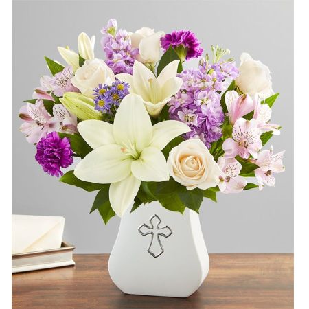 Conroy's Flowers El Cajon El Cajon - Send love and support with "Sacred Blessings™ Lavender & White." Lavender and white blooms are hand-gathered in our Sacred Blessings Vase, featuring a silver-embossed cross: an eternal symbol of hope. This truly touching gesture is designed to comfort the people we care about. With our same-day flower delivery, you can promptly share this soothing arrangement with those who are facing difficult times. "Sacred Blessings™ Lavender & White" is a heartfelt expression that brings solace and warmth, offering support during challenging moments.





