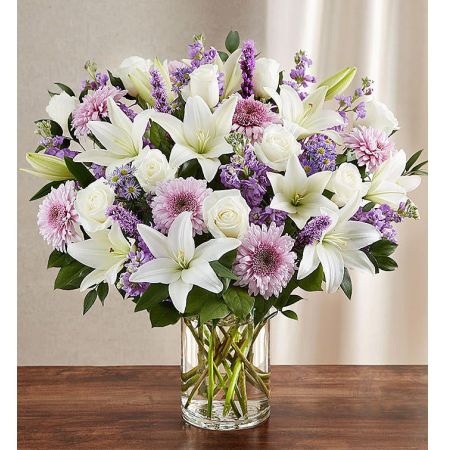 Conroy's Flowers El Cajon El Cajon - Deliver a deeply heartfelt sentiment with "Sincerest Sorrow™ Lavender & White." This lush and bountiful bouquet features lavender and white blooms in an elegant mix of roses, lilies, and ceremonies. It is hand-designed inside a classic clear glass vase, making it a genuinely heartwarming gesture when sent to a service or to the home of family or friends. With our same-day flower delivery, you can promptly express your condolences and offer comfort to those who are grieving. "Sincerest Sorrow™ Lavender & White" is a thoughtful and elegant arrangement that brings warmth and solace during difficult times.





