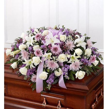 Conroy's Flowers El Cajon El Cajon - When we lose someone dear to us, we want to respond with a fitting gesture of respect and admiration. Our half casket cover, crafted with care and artistry by our expert florists with lavender cremones, mums, white roses, and accented with a lavender satin ribbon, is an unforgettable way to commemorate a lifetime of loving devotion.