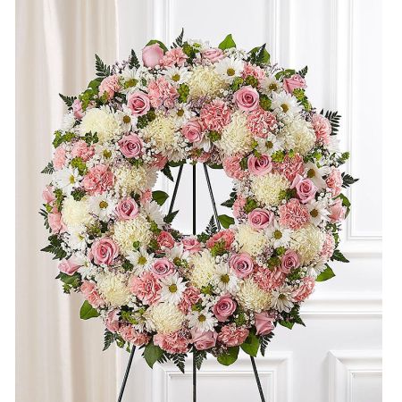 Conroy's Flowers El Cajon El Cajon - Capture the serene memories shared with a loved one through our Serene Blessings™ Standing Wreath in Pink & White. Crafted by our expert local florists, this standing wreath is a beautiful tribute to celebrate cherished moments. The arrangement features graceful pink and white blooms meticulously arranged for a lush and full presentation. As a traditional funeral arrangement, it serves as a lovely and heartfelt way to honor the life of your loved one.







