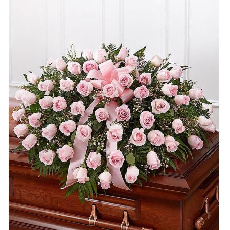 Conroy's Flowers El Cajon El Cajon - The Pink Rose Half Casket Cover is a poignant tribute, embodying grace, love, and admiration with over 50 soft pink roses. Carefully crafted by our expert florists, this arrangement serves as a beautiful and sentimental expression to honor the memory of someone deeply cherished. The delicate pink hues and meticulous arrangement, along with the elegant touch of a pink satin ribbon, create a heartfelt and unforgettable display. It is a meaningful way to commemorate a lifetime of unconditional love and to offer solace during a time of grief.






