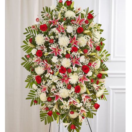 Conroy's Flowers El Cajon El Cajon - Celebrate the enduring beauty of a life well-lived with our Red Rose and Lily Standing Spray. This elegant and thoughtful arrangement features a combination of radiant red, soft pink, and pure white blooms. Expertly crafted, it serves as a traditional and heartfelt display for memorial services, symbolizing love and remembrance during moments of grief. Express your deepest condolences through the timeless beauty of this arrangement, offering a touching tribute to honor the memory of your loved one.