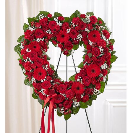 Conroy's Flowers El Cajon El Cajon - Express your eternal love for someone who has passed away with the Always Remember™ Floral Heart Tribute in radiant red. This standing, open heart-shaped floral arrangement is a heartfelt tribute crafted by our caring florists. It features an assortment of radiant red blooms, symbolizing the enduring love that lives on forever in the hearts of those left behind. The arrangement is a magnificent and fitting tribute for funeral services, capturing the depth of emotion and lasting connection you share with your loved one.