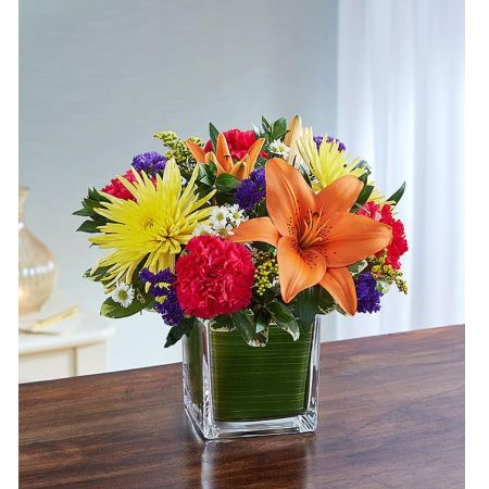 Conroy's Flowers El Cajon El Cajon - In a time of darkness, make a small yet deeply appreciated difference with "Soothing Sorrows Multicolor Bright." This sympathy arrangement features sprightly pink roses, carnations, orange lilies, and yellow mums, expertly gathered together in a clear glass cube lined with a Ti leaf ribbon. It serves as an uplifting gesture of comfort and healing. With our same-day flower delivery, you can promptly convey your condolences and offer a source of comfort to those in mourning. "Soothing Sorrows Multicolor Bright" is a vibrant and heartfelt expression that brings warmth and solace during difficult moments.