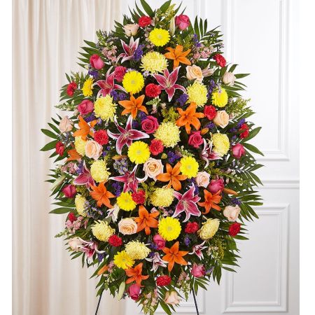 Conroy's Flowers El Cajon El Cajon - Celebrate the vibrant spirit and passion for life with our Sympathy Standing Spray - Bright. This classic standing spray is thoughtfully designed to capture the colorful essence of your loved one's personality. Skilled local florists craft a lush and full presentation, incorporating a vibrant mix of blooms that symbolize the unique and one-of-a-kind nature of the person you're honoring. The bright and lively arrangement serves as a memorable tribute, expressing the joy and energy they brought to the lives of those around them. It stands as a beautiful reflection of their enduring spirit during this difficult time.