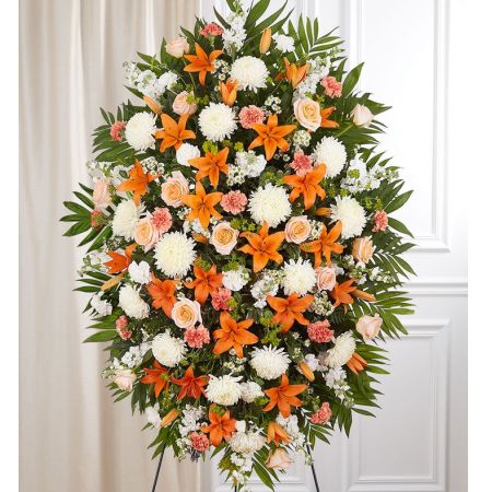 Conroy's Flowers El Cajon El Cajon - Our Peach, Orange & White Sympathy Standing Spray is a heartfelt tribute to honor the joyful spirit and welcoming personality of your loved one. Expertly crafted with warm orange, peach, and white blooms, this classic standing spray arrangement is designed to create a touching and elegant display. The vibrant colors symbolize the happiness that your loved one brought to the lives of many. It serves as a beautiful and meaningful tribute to celebrate their positive impact and bring comfort during this difficult time.