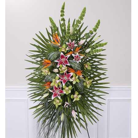 Conroy's Flowers El Cajon El Cajon - Our Eternal Paradise™ Standing Spray is a vibrant and tropical tribute to celebrate the life of your loved one who has embarked on their journey to eternal paradise. Expertly handcrafted by our skilled florists, this eye-catching arrangement showcases an abundance of tropical blooms, accentuated by elegant wisps of bear grass delicately woven through fresh greenery. The vibrant colors and lush design symbolize the warmth and beauty that the departed brought into the world, creating a fitting and uplifting tribute during this challenging time.