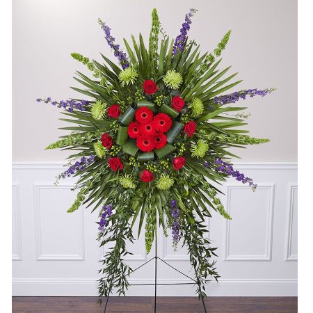 Conroy's Flowers El Cajon El Cajon - When it’s for the one who always radiated warmth and beauty, no ordinary tribute will do. Our Divine Tribute standing spray is a glorious display, indeed. A grand arrangement of vibrant reds, purples and tropical greens in a dramatic radiating design, it features cascades of trailing ruscus for striking accentuation. A truly divine expression of your condolences.<br/><br/>