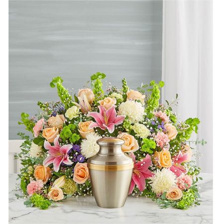 Conroy's Flowers El Cajon El Cajon - The Crescent Cremation Arrangement in pastel tones is delicately handcrafted to convey sincere condolences during a time of grief. Its unique crescent shape, adorned with a cascade of soft pastel blooms, symbolizes a peaceful and comforting tribute. This arrangement is thoughtfully designed to bring solace and offer support to those mourning the loss of a loved one. With its gentle hues and carefully arranged flowers, it serves as a heartfelt expression of sympathy and remembrance.





