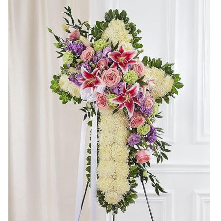 Conroy's Flowers El Cajon El Cajon - In times of loss, express your faith, love, and compassion with our Peace & Prayers™ Standing Cross in pastel hues. Our skilled florists handcraft this beautiful standing cross arrangement using a bed of pure white mums shaped into a cross, complemented by a cascade of soft pastel blooms. This thoughtful and serene display serves as a touching tribute, offering peace and comfort to those going through a difficult time.





