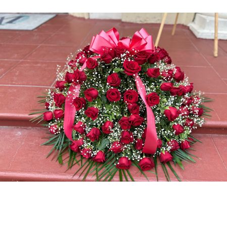 Conroy's Flowers El Cajon El Cajon - The Red Rose Half Casket Cover is a classic and heartfelt expression of love and admiration for someone dear who has passed away. Carefully crafted by our expert florists, this arrangement features over 50 premium red roses, symbolizing deep love and respect. The fresh greenery adds a touch of natural beauty, while a red satin ribbon accents the display, creating a striking and unforgettable tribute. This half - casket cover serves as a meaningful and elegant way to commemorate a lifetime of esteem and adoration for the departed.






