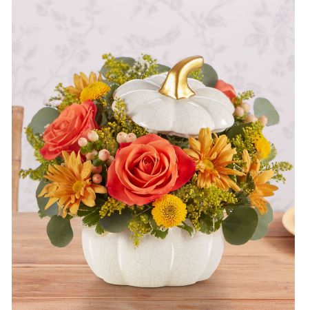 Conroy's Flowers El Cajon El Cajon - EXCLUSIVE A plentiful mix of blooms gives our autumn arrangement an undeniable charm. Loosely gathered with pops of orange and yellow, it’s the perfect contrast to our modern-styled pumpkin. Featuring a white satin finish, crackle detail and rich golden accents, this harvest-inspired container is perfect for repurposing.