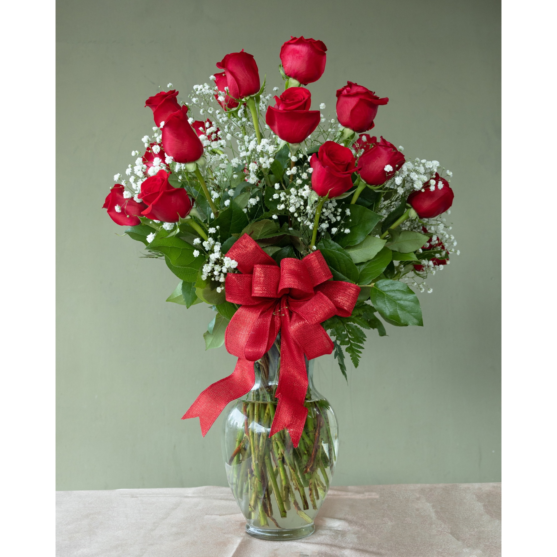 Conroy's Flowers El Cajon El Cajon - Surprise your special someone with our Premium Long-Stem Red Roses – an elegant gesture for the one you trust, the one you can turn to, and the one you love with all your heart. Expertly arranged by our skilled florists, these premium long-stem red roses come with lush greenery inside a classic glass vase.With our same-day flower delivery, you can convey your love and admiration promptly. Make a lasting impression and express your deepest emotions with the timeless beauty of premium long-stem red roses.