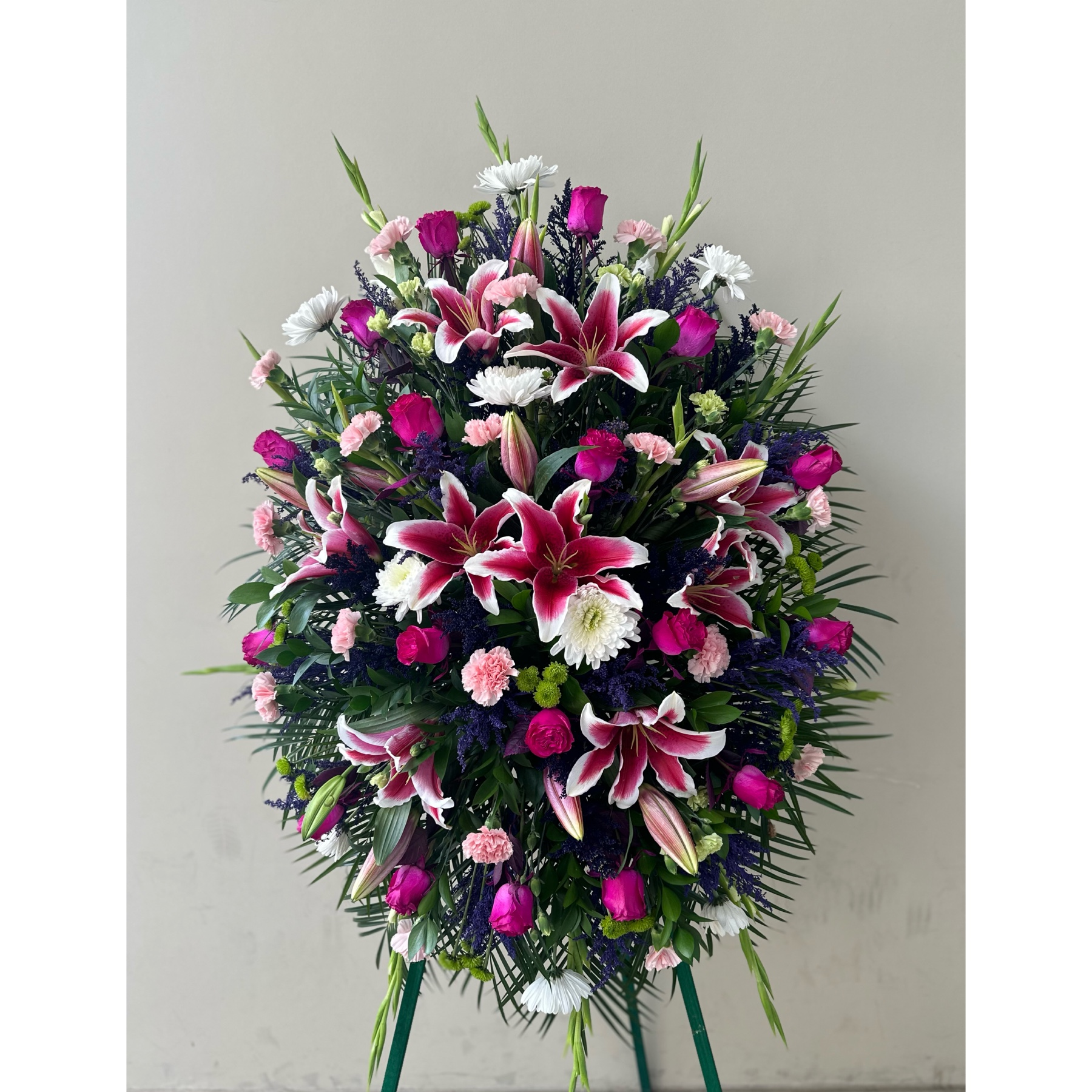 Conroy's Flowers El Cajon El Cajon - Our Pastel Sympathy Standing Spray is a heartfelt expression of remembrance, capturing the essence of love and cherished memories. Meticulously handcrafted by expert local florists, the arrangement features soft pastel blooms arranged in a lush and graceful display. This classic standing spray is a symbol of the enduring beauty and warmth that the departed brought into the lives of those around them. It stands as a touching tribute, providing comfort and solace during a time of loss and celebration of a life well-lived.