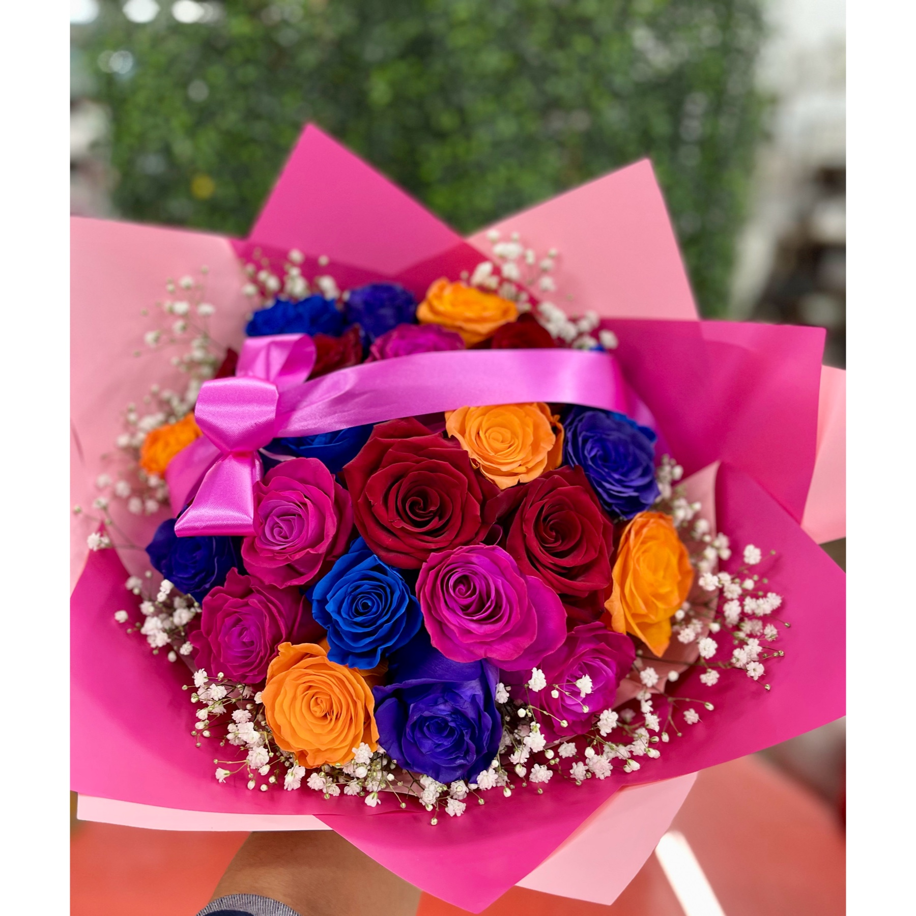 Conroy's Flowers El Cajon El Cajon - Embrace the beauty of diversity with our  Rose Bouquet in assorted colors. Each rose is elegantly wrapped in our most luxurious paper, and the bouquet is carefully decorated to create an everlasting impression on anyone fortunate enough to behold this stunning piece. For an even more grand and lavish gesture, consider upgrading to Deluxe, where you'll receive twice the size with an impressive 24 stems! This abundant bouquet is bound to make a statement, expressing your emotions in a truly extravagant way. Experience the joy of gifting and receiving this bountiful collection of roses.