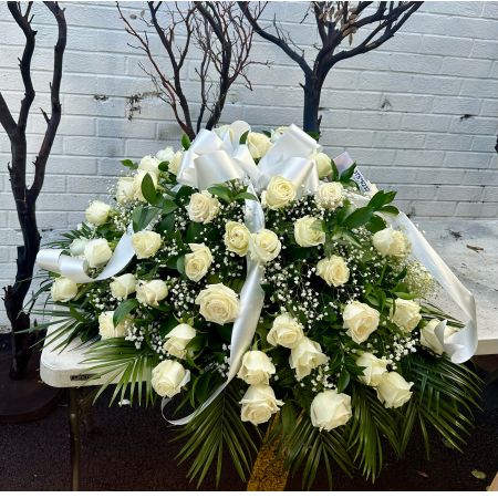 Conroy's Flowers El Cajon El Cajon - The precious moments spent with loved ones are the moments we want to hold onto forever. Capture this sentiment with a timeless display of all white. Our half casket cover, crafted with care and artistry by our expert florists with over 50 snow white roses, white monte casino, and accented with a white satin ribbon, is an unforgettable way to commemorate a lifetime of shared loving experiences.