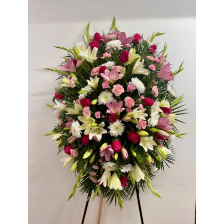 Conroy's Flowers El Cajon El Cajon - Capture the enduring warmth and kindness of your loved one with our Pink & White Funeral Standing Spray. This classic arrangement is elegantly crafted with soothing pink and white blooms, creating a lush and full presentation that serves as a beautiful and memorable tribute. Express your deepest condolences through the serene beauty of this standing spray, offering solace and remembrance during a difficult time.