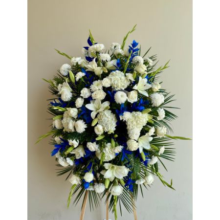 Conroy's Flowers El Cajon El Cajon - The Blue & White Funeral Standing Spray is a dignified and elegant tribute, expertly crafted to honor the memory of someone dear. Meticulously arranged by our skilled florists, this standing spray features a combination of pristine white and rich blue blooms. The careful placement of each flower creates a lush and full presentation, symbolizing respect and remembrance. This arrangement serves as a proud and heartfelt commemoration, offering solace and support during a difficult time. It stands as a meaningful expression of sympathy, conveying the depth of emotions felt for the departed loved one.





