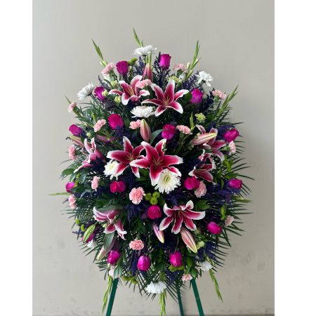 Conroy's Flowers El Cajon El Cajon - Our Pastel Sympathy Standing Spray is a heartfelt expression of remembrance, capturing the essence of love and cherished memories. Meticulously handcrafted by expert local florists, the arrangement features soft pastel blooms arranged in a lush and graceful display. This classic standing spray is a symbol of the enduring beauty and warmth that the departed brought into the lives of those around them. It stands as a touching tribute, providing comfort and solace during a time of loss and celebration of a life well-lived.