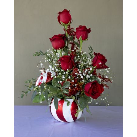 Conroy's Flowers El Cajon El Cajon - Embrace the holiday spirit with 'Frosted Ornament Lullaby.' This enchanting arrangement, nestled in a festive ornament ceramic container, boasts delightful shades of red and white. Please note, containers may vary, ensuring a unique touch to your seasonal decor. Capture the magic of the holidays with this charming creation.

**CONTAINERS MAY VARY