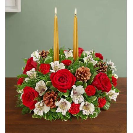 Conroy's Flowers El Cajon El Cajon - Our festive centerpiece brings a classic touch to all your holiday celebrations. We’ve gathered a mix of red and white blooms with lush greens and rustic pinecones. Gold taper candles add a warm and cozy Christmas glow.