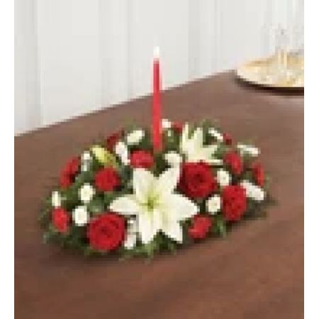 Conroy's Flowers El Cajon El Cajon - Our traditional table arrangement creates the perfect centerpiece for your Christmas celebration. Beautifully designed with long-lasting blooms in seasonal colors, this fragrant gathering features red taper candles to cast a warm, cozy glow throughout the holidays.
