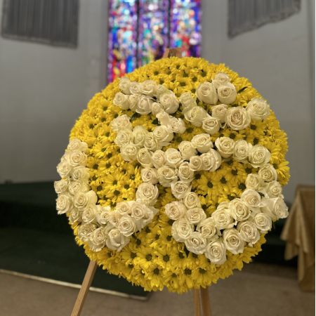 Conroy's Flowers El Cajon El Cajon - Our Om Funeral Wreath is a deeply symbolic tribute, crafted with reverence to honor the spiritual journey of your loved one. Featuring fresh, premium blooms arranged meticulously around the sacred Om symbol, this wreath embodies peace, serenity, and the eternal connection between life and the divine. Perfect for Desi and Hindu funeral services, this elegant wreath serves as a beautiful expression of respect and love. Please note that this item requires a 48-hour notice to ensure its creation with the utmost care and attention.