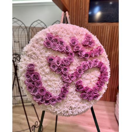 Conroy's Flowers El Cajon El Cajon - Our Om Funeral Wreath is a deeply symbolic tribute, crafted with reverence to honor the spiritual journey of your loved one. Featuring fresh, premium blooms arranged meticulously around the sacred Om symbol, this wreath embodies peace, serenity, and the eternal connection between life and the divine. Perfect for Desi and Hindu funeral services, this elegant wreath serves as a beautiful expression of respect and love. Please note that this item requires a 48-hour notice to ensure its creation with the utmost care and attention.
