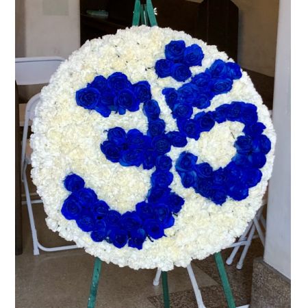 Conroy's Flowers El Cajon El Cajon - Our Om Funeral Wreath is a deeply symbolic tribute, crafted with reverence to honor the spiritual journey of your loved one. Featuring fresh, premium blooms arranged meticulously around the sacred Om symbol, this wreath embodies peace, serenity, and the eternal connection between life and the divine. Perfect for Desi and Hindu funeral services, this elegant wreath serves as a beautiful expression of respect and love. 


Please note that this item requires a 48-hour notice to ensure its creation with the utmost care and attention.