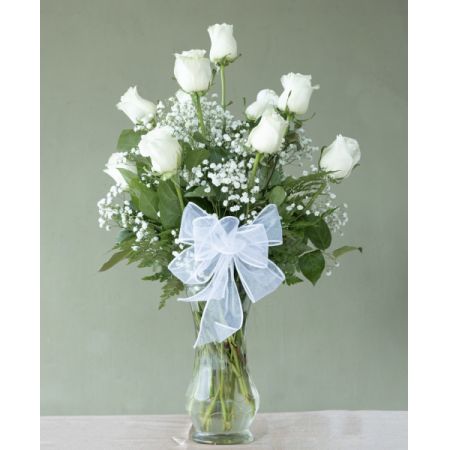 Conroy's Flowers El Cajon El Cajon - Indulge in the timeless beauty of our Premium Long Stem White Roses, elegantly crafted and presented in a glass vase. Choose from options of One, Two, or Three Dozen to make a stunning and graceful statement. The purity and elegance of white roses make them a classic choice for various occasions, from expressions of sympathy to celebrations of love and purity. With our same-day flower delivery, you can ensure that these exquisite white roses arrive promptly, ready to convey your sentiments in the most elegant and sophisticated manner. Embrace the simplicity and beauty of white roses, creating a memorable and timeless gift for your special moments.