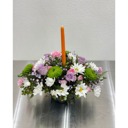 Conroy's Flowers El Cajon El Cajon - Brighten up your table with our Spring Candlelight Centerpiece ??️ Bursting with cheerful blooms in soft pastels and topped with a vibrant taper candle, this arrangement is perfect for Easter brunch, spring gatherings, or simply adding a little glow to your day!
