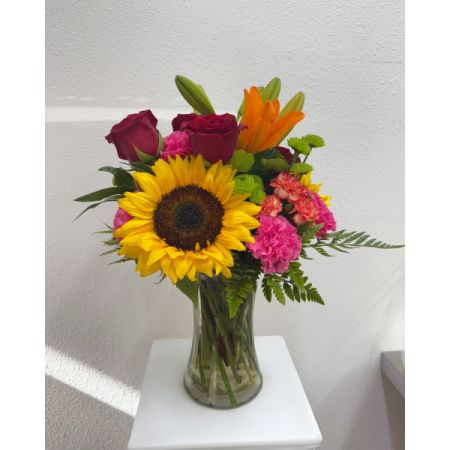 Conroy's Flowers El Cajon El Cajon - Experience "The Sunshine Embrace," a bouquet designed to convey your sentiments to someone special with the warmth of a loving embrace. This vibrant flower arrangement features a rich gathering of yellow and orange blooms, complemented by pops of bright pink and purple. More than just a gift, it's a heartfelt expression of the emotions you hold inside. With our same-day flower delivery, you can promptly share the radiant beauty and uplifting spirit of "The Sunshine Embrace" with your loved ones, making any moment more special and meaningful.






