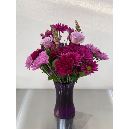Conroy's Flowers El Cajon El Cajon -  This delightful lavender bouquet is crafted with accents of pink and lush greenery, presented in our striking fluted violet gathering vase. The vase, designed in vintage pressed glass with ribbed detailing, captures the rich beauty of the blooms and adds an extra touch of elegance. It's a perfect choice to express your feelings with grace and capture the imagination of your loved ones.