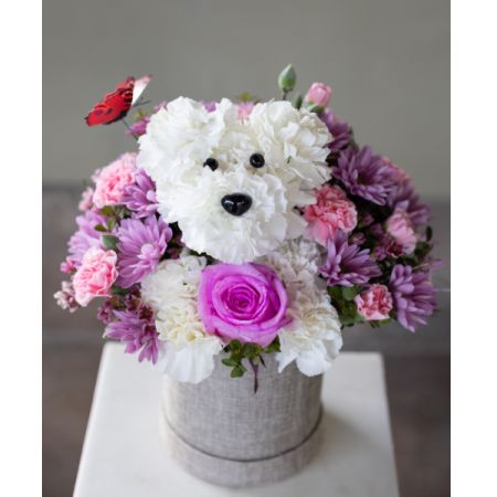 Conroy's Flowers El Cajon El Cajon - A delightful floral arrangement featuring a charming dog crafted from pink and lavender blooms. Perfect for Mother's Day, this adorable creation is sure to bring joy and warmth to your mom's heart.
