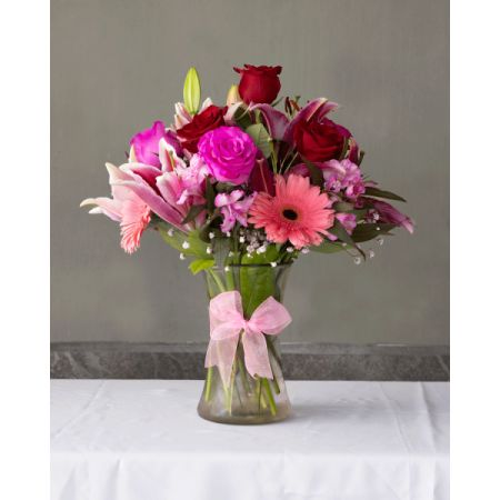 Conroy's Flowers El Cajon El Cajon - Make them feel like the IT girl with this beautiful assortment of red and pink blooms! Carefully designed into a clear vase decorated with a pink ribbon.
