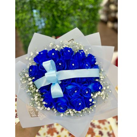 Conroy's Flowers El Cajon El Cajon - Elevate your expression of love with our stunning 25 Rose Bouquet in captivating blue. Each rose is meticulously arranged and presented in our most luxurious wrapping paper, creating a breathtaking and memorable gift. The careful decoration ensures that this bouquet leaves an everlasting impression on anyone fortunate enough to behold its beauty. For an even more grand gesture, consider upgrading to Deluxe and double the impact with 50 stems! This generous bouquet is bound to make a statement and significantly convey your heartfelt emotions. Take advantage of our same-day flower delivery to ensure that this elegant and abundant display of roses reaches its destination promptly. Make a lasting impression with the timeless beauty of roses.