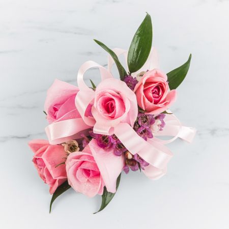 Morningside Florist Rancho Cordova - A classic pink corsage hand-tied in pink satin that compliments any outfit. A beautiful addition to any prom, formal, or wedding event.  Please inquire about other color options. Leave note on order or call to specify ribbon color.
Unavailable for Delivery.