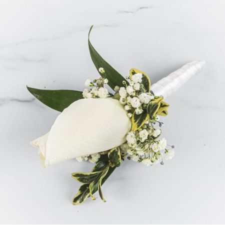 Morningside Florist Rancho Cordova - A classic white boutonnière that compliments any suit. A perfect addition for any prom, formal, or wedding event.  Please inquire about other color options.
Unavailable for Delivery.
