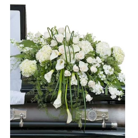 Morningside Florist Rancho Cordova - Elegant white premium flowers in a lush casket spray.  The Elegant Love Casket Spray is a testament to timeless beauty and grace, designed to convey a sense of peace and eternal love. This lush casket spray is meticulously composed of premium white flowers, each bloom carefully chosen for its purity and sophistication. In life's final farewell, this floral arrangement speaks volumes where words fall short, offering a silent yet profound tribute to the one who has passed.  Centered around the dignified beauty of white roses, which have long been associated with reverence and remembrance, the spray radiates a comforting glow of serenity. Accompanied by the elegant calla lilies, symbols of majestic beauty and resurrection, the arrangement is imbued with hope and the promise of new beginnings. Hydrangeas contribute to the fullness of the spray, their ample blooms representing heartfelt emotions and the unity of family gathered in mourning. Accents of delicate seasonal white florals intersperse the arrangement, adding depth and texture, while lush green foliage provides a bed of tranquility for the flowers to rest upon. This Elegant Love Casket Spray is not just a decorative piece; it's a final gift of love to the departed, a symbol of cherished memories that will continue to bloom in the hearts of loved ones forever.