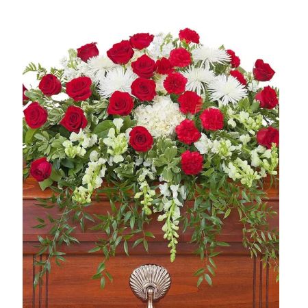 Morningside Florist Rancho Cordova - Red and white premium varieties of flowers combine with lush foliage to make this casket spray impression of enduring strength.