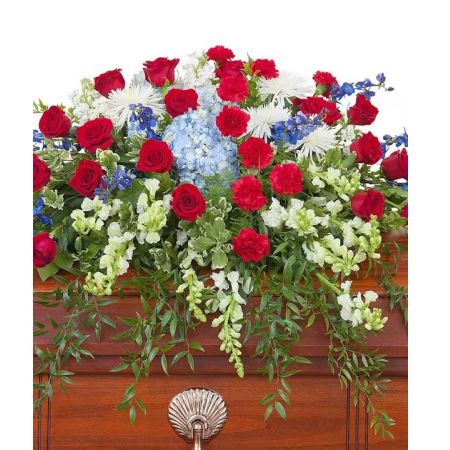 Morningside Florist Rancho Cordova - This beautiful red, white and blue casket spray gives tribute to the one who served with honor.