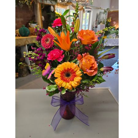 Morningside Florist Rancho Cordova - A sunset vibe is all about warmth, serenity, and a hint of nostalgia. Imagine the sky painted in hues of deep orange, soft pink, and glowing gold, gently fading into twilight. There's a peaceful energy in the air\u2014whether you're watching the sun dip below the horizon by the beach, from a rooftop, or through the trees in a quiet park, these flowers capture the essence perfectly.