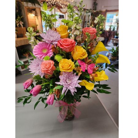 Morningside Florist Rancho Cordova - A Calla Lily and Tulip arrangement is a beautiful blend of elegance and charm. The sleek, trumpet-shaped Calla Lilies pair wonderfully with the soft, cup-shaped Tulips, creating a harmonious balance. These arrangements often feature complementary colors and flowers, such as Roses, Gerbera, larkspur and alstroemeria. This arrangement is enhanced with greenery like eucalyptus, ferns, and sometimes accented with delicate filler flowers. It's perfect for weddings, formal events, or as a sophisticated centerpiece.