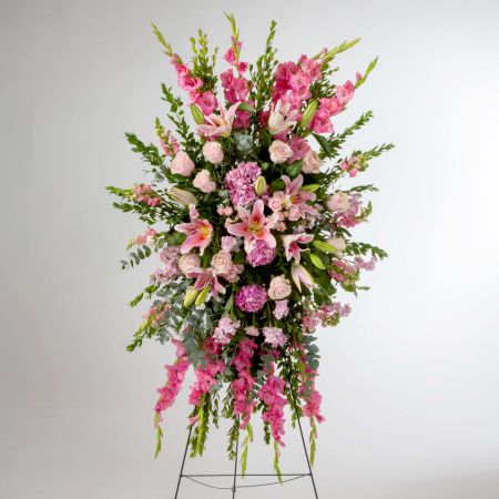 Morningside Florist Rancho Cordova - Pink roses, lilies, and more come together for a blushing pink standing funeral spray.